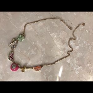 Gold fruit necklace.